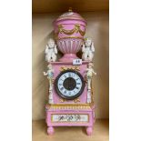 A 19th C French porcelain cased mantel clock, H. 59cm. One rear foot missing.