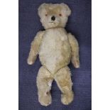 A large English straw field articulated teddy bear, H. 96cm.