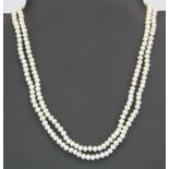 A two strand cultured pearl necklace on a vintage silver and marcasite clasp.
