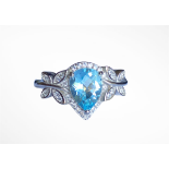 A 925 silver ring set with a pear cut blue topaz, (P).