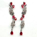 A pair of butterfly shaped ruby and white stone set drop earrings, L. 5.2cm.