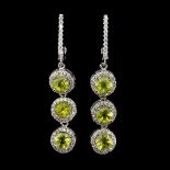 A pair of 925 silver drop earrings set with round cut peridots and white stones, L. 4.5cm.