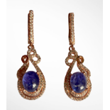 A pair of 925 silver rose gold gilt drop earrings set with cabochon cut tanzanites and white stones,