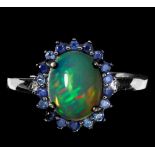 A 925 silver ring set with a cabochon cut opal surrounded by sapphires, (N.5).