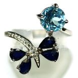 A matching 925 silver ring set with pear cut sapphires and blue topaz, (M).