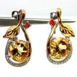 A pair of 925 silver gilt earrings set with round cut citrines and fancy orange sapphires, L. 2.