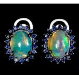 A matching pair of 925 silver cluster earrings set with cabochon cut opal and sapphires, L. 1.2cm.