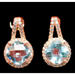 A pair of 925 silver rose gold gilt earrings set with swiss blue topaz and white stones, L. 1.7cm.