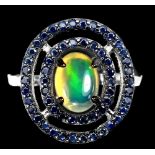 A matching 925 silver cluster ring set with a cabochon cut opal and sapphires, (O).