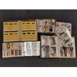 Two well filled albums of cigarette and trade cards together with bus photographs.