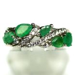 A 925 silver ring set with pear cut emeralds and white stones, (M).
