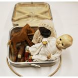 A vanity case of dolls and toys.