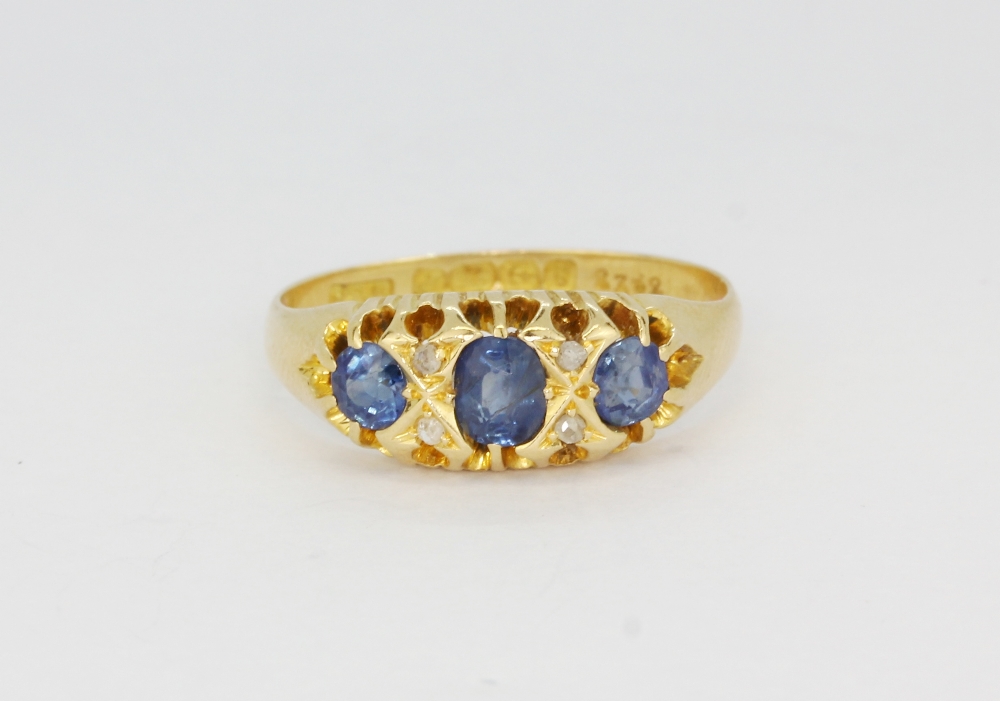 An antique hallmarked 18ct yellow gold ring set with sapphires and rose cut diamonds, (Q).