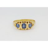 An antique hallmarked 18ct yellow gold ring set with sapphires and rose cut diamonds, (Q).