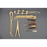 Three antique carved ivory necklaces and other items.