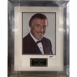 Autograph interest: A signed photograph of Bruce Forsyth, 35 x 44cm. With certificate.