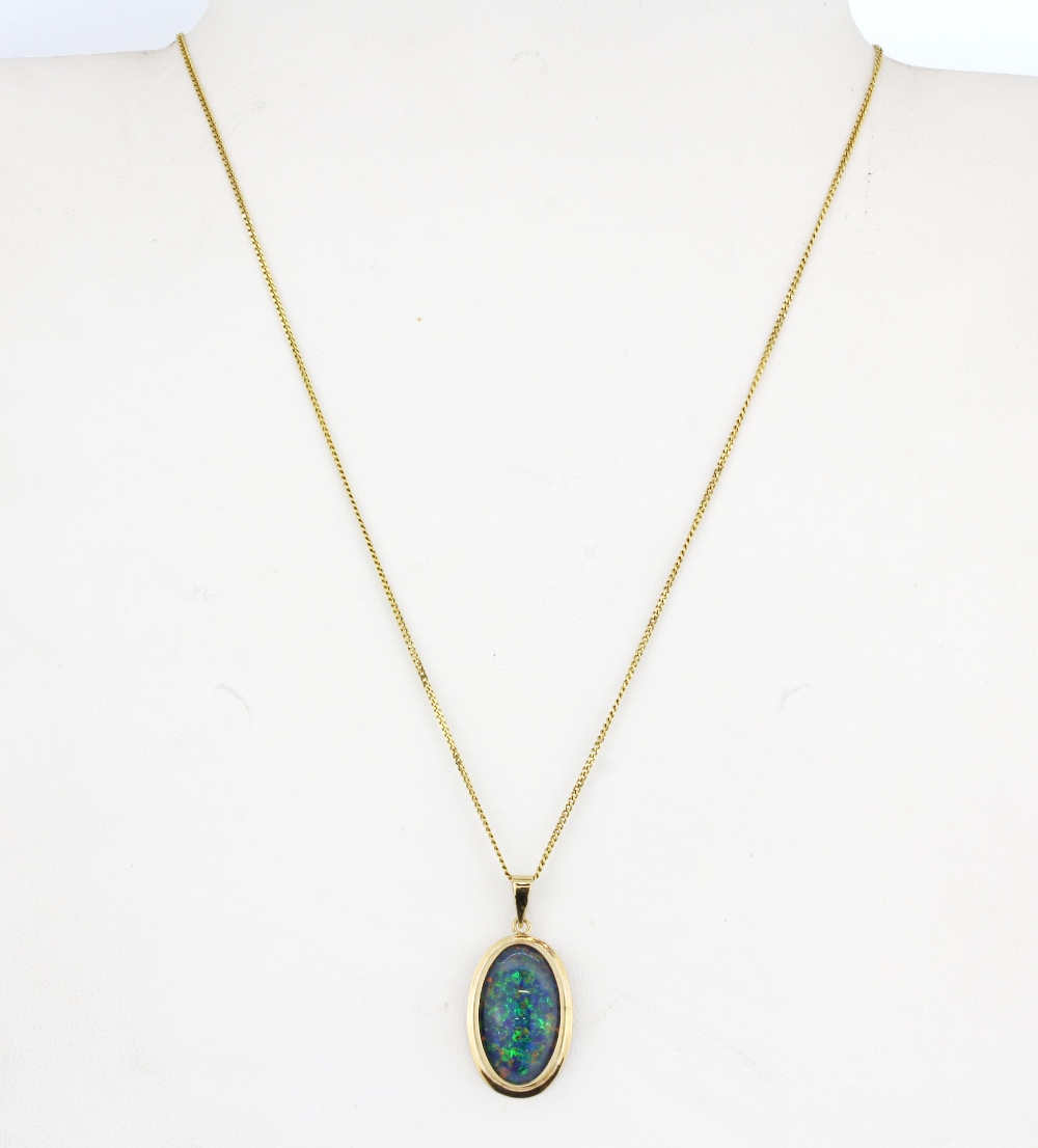 A large 9ct yellow gold (stamped 375) opal triplet set pendant (L.3cm) on a 9ct yellow gold chain, - Image 2 of 2