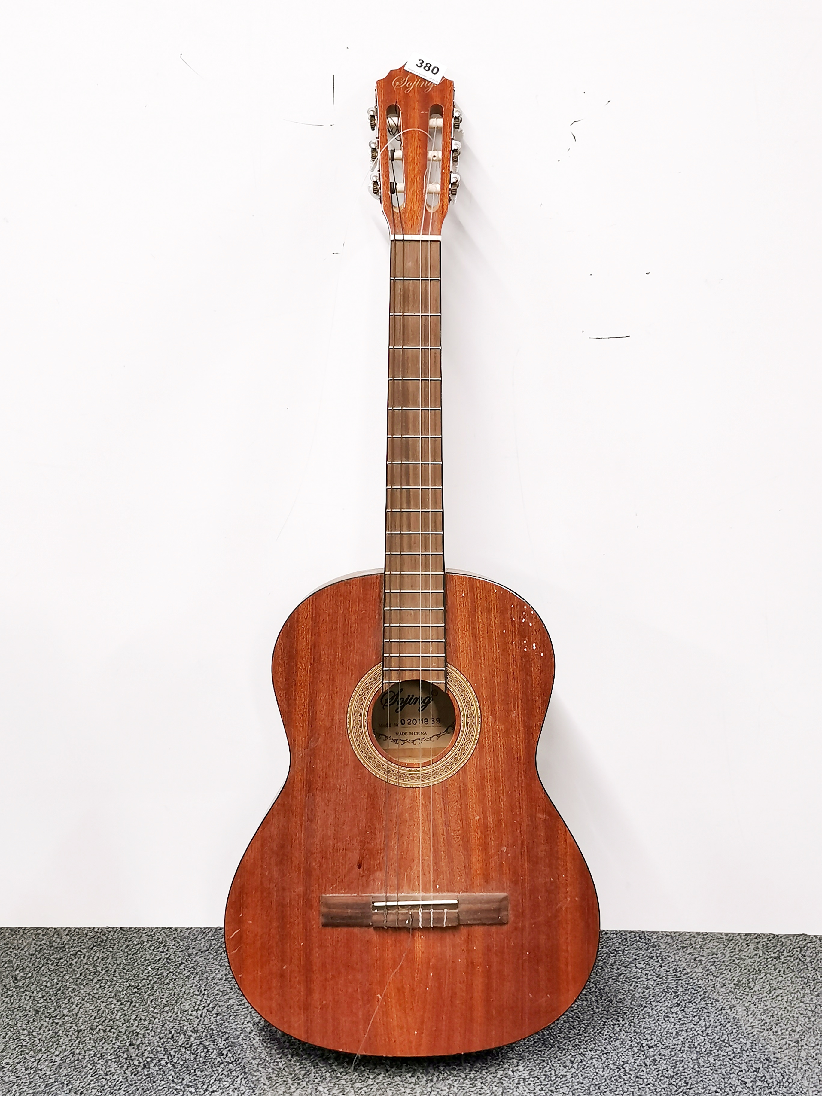 A Sojing acoustic guitar.