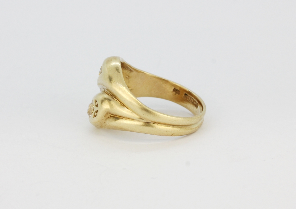 A hallmarked 9ct yellow gold double snake head ring set with a brilliant cut diamond and a round cut - Image 2 of 2