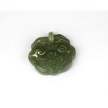 A Chinese carved celadon jade padlock, W. 4.8cm.