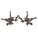 A pair of 925 silver rose gold gilt drop earrings shaped as birds in tree branches and set with