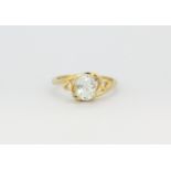 A 14ct yellow gold (stamped 14k) ring set with an oval cut aquamarine and diamonds, (N.5).