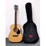 A Cort acoustic guitar and case.