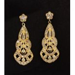 A pair of 14ct yellow gold drop earrings set with diamonds, approx. L. 4.1cm.