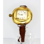 An early 20thC lady's 18ct gold outer cased wrist watch. D. 3.2cms.