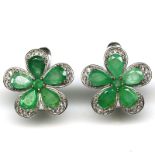A pair of 925 silver flower shaped earrings set with oval cut emeralds and white stones, Dia. 1.