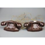 A pair of 1930's bakelite toy telephones.