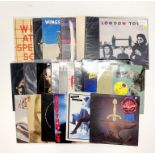 A quantity of pop and rock LP records.