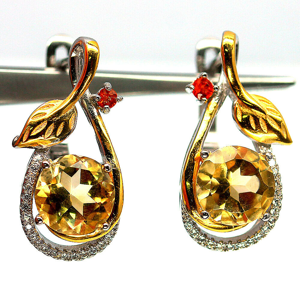 A pair of 925 silver gilt earrings set with round cut citrines and fancy orange sapphires, L. 2.