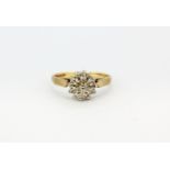 A hallmarked 9ct yellow gold diamond set cluster ring, (P.5), approx. 3.1gr.
