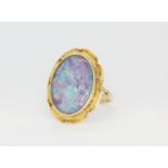 A 14ct yellow gold ring set with a large opal triplet, (N.5).