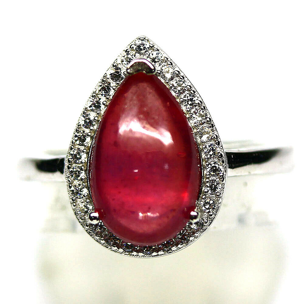 A 925 silver ring set with pear cabochon cut ruby and white stones, (O).