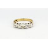 A hallmarked 9ct yellow and white gold ring set with five graduated brilliant cut diamonds,