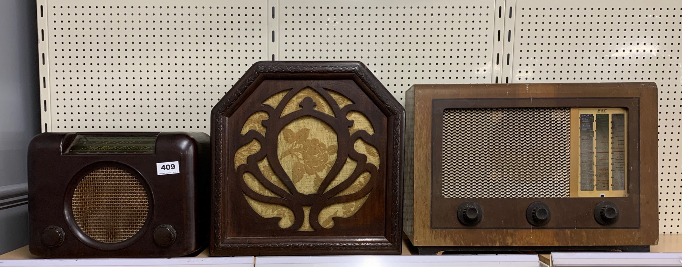 A vintage bakelite radio with a wooden cased speaker and a further GEC radio.