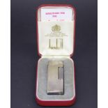 A boxed Dunhill silver plated lighter.