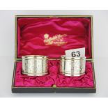 A pair of cased Edwardian hallmarked silver napkin rings, Birmingham c. 1902.