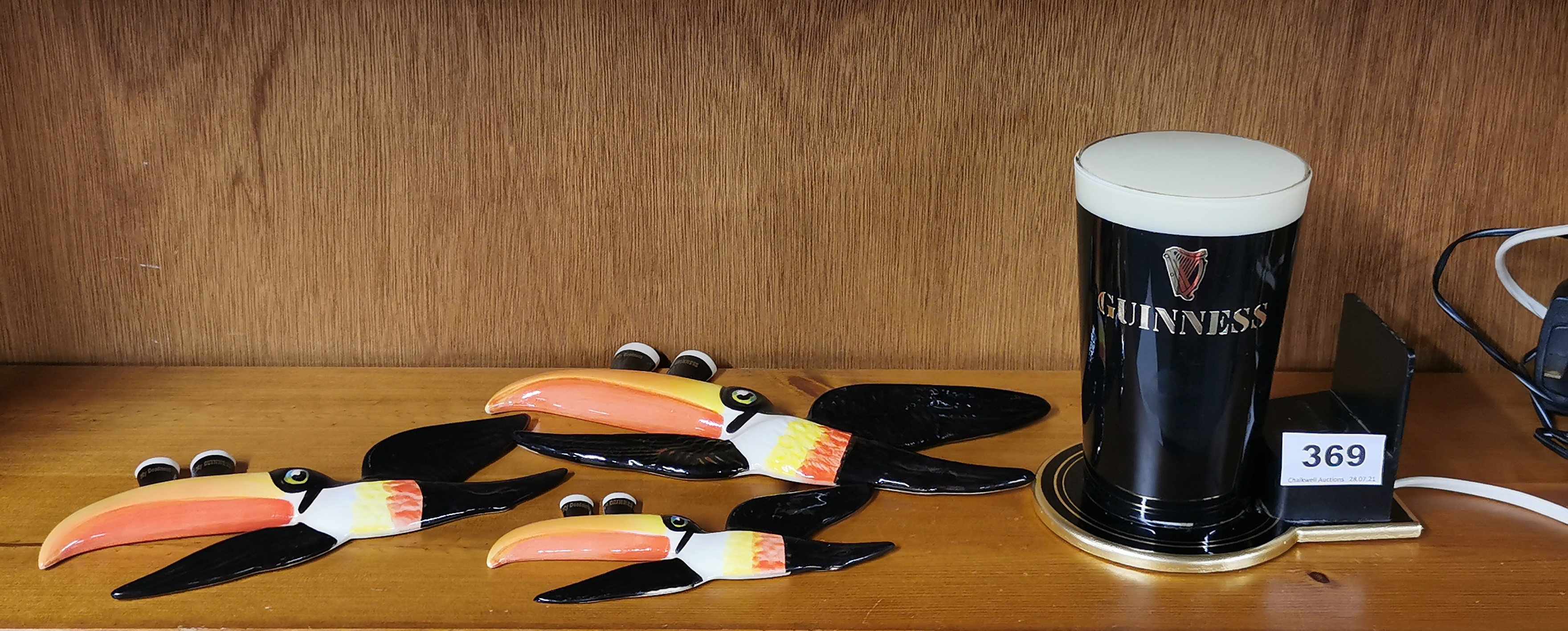 A set of three Carltonware Guinness advertising flying toucans and a Guinness bar light.