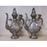 A pair of Chinese silvered bronze wine jugs, one with old wax export seal H. 31cm.