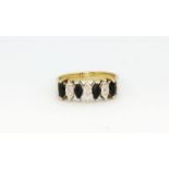 A hallmarked 9ct yellow gold ring set with sapphires and diamonds, (P).