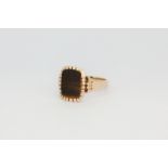 A 14ct yellow gold tiger's eye signet ring, (J.5).