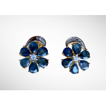 A pair of 925 silver gilt flower shaped earrings set with pear cut sapphires, L. 1.5cm.