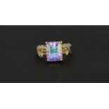 A 14ct yellow gold (stamped 14k) ring set with a large square cut mystic topaz and diamond set