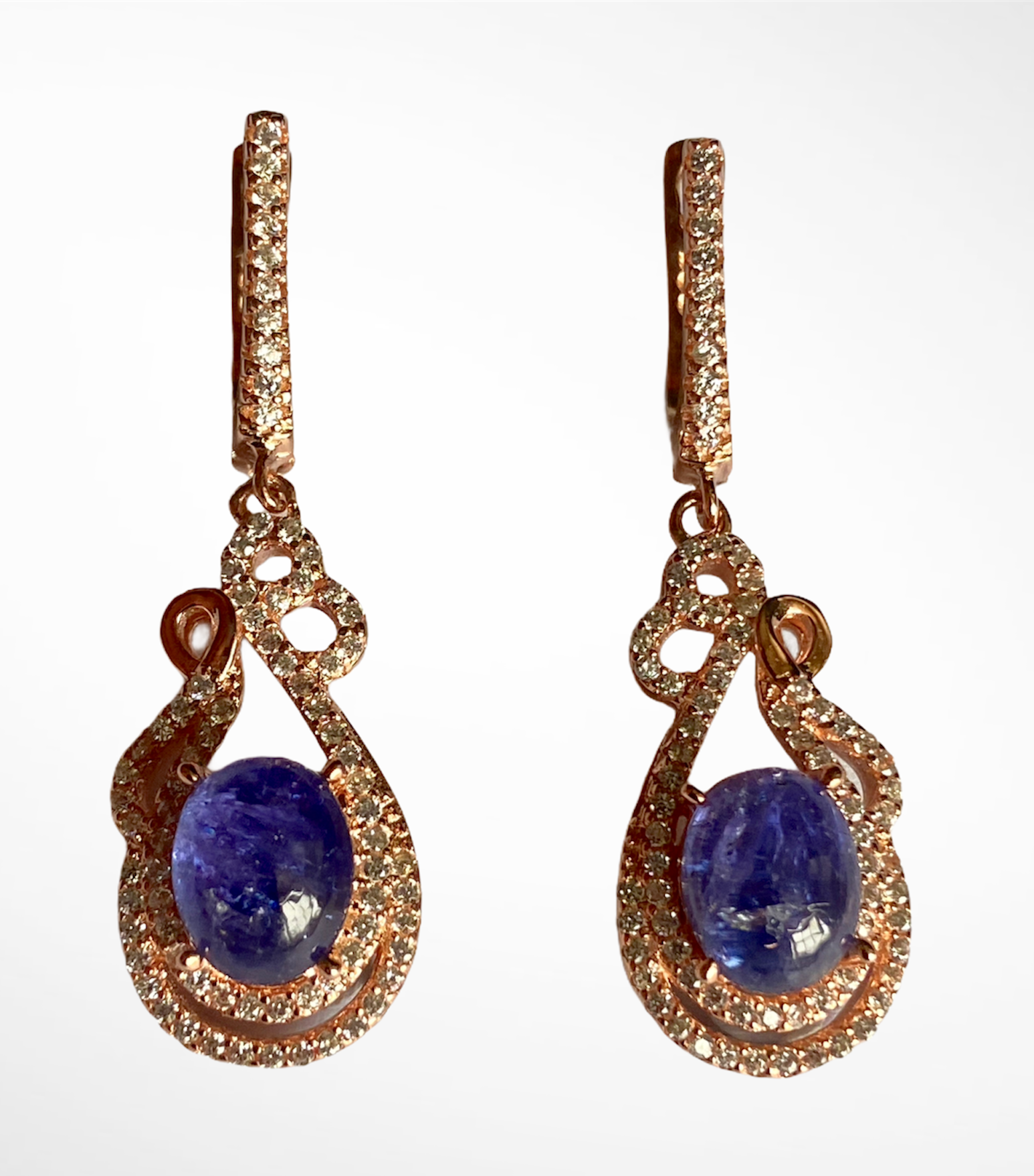 A pair of 925 silver rose gold gilt drop earrings set with cabochon cut tanzanites and white stones,