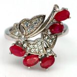 A matching 925 silver ruby and white stone ring, (L.5).