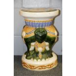 A Chinese glazed pottery double elephant head garden stool, H. 42cm.
