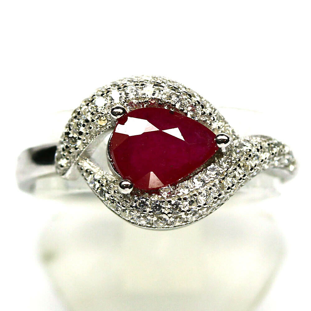 A 925 silver ring set with pear cut rubies and white stones, (Q).